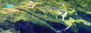Scenic aerial view of Simplon Pass with winding mountain roads and green alpine landscape in Switzerland