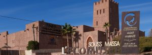 Entrance to Souss Massa National Park in Morocco featuring traditional architecture and ecological museum signage.