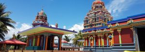 Sri Siva Subramaniya Temple in Nadi Fiji with colorful Dravidian towers and palm trees under a bright blue sky