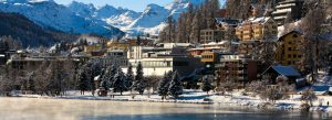 Snow-covered St. Moritz town with frozen lake and Swiss Alps during winter in Switzerland