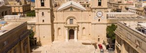 Front view of St. John’s Co-Cathedral in Valletta, Malta, with historic Baroque architecture.