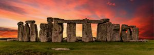 Ancient Stonehenge monument at sunset with massive standing stones in Wiltshire, England.