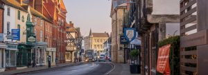 Historic street view in Stratford-upon-Avon featuring charming Tudor-style buildings and traditional English architecture.