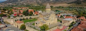 Aerial view of Svetitskhoveli Cathedral surrounded by ancient walls in Mtskheta, Georgia.