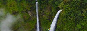 Tad Fane Waterfall surrounded by lush tropical rainforest on the Bolaven Plateau in southern Laos