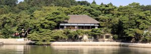 Traditional Japanese tea house surrounded by pine trees along the waterfront in Matsushima, Japan