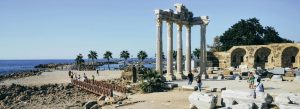 Temple of Apollo ruins in the ancient city of Side on Turkey’s Mediterranean coast with historic columns overlooking the sea.