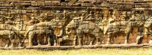 Stone carvings of elephants and ancient Khmer figures at the Terrace of the Elephants in Angkor Thom, Cambodia
