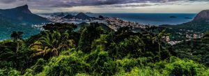 Panoramic view of Tijuca National Park overlooking Rio de Janeiro coastline and lush tropical rainforest in Brazil.