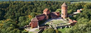 Turaida Castle in Sigulda, Latvia surrounded by green forest and historic medieval architecture