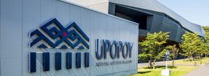 Entrance signage of Upopoy National Ainu Museum and Park in Shiraoi, Hokkaido, Japan on a sunny day.