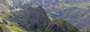 Panoramic view of the Cirque de Mafate with dramatic volcanic peaks, deep valleys, and lush green landscapes in Réunion Island.